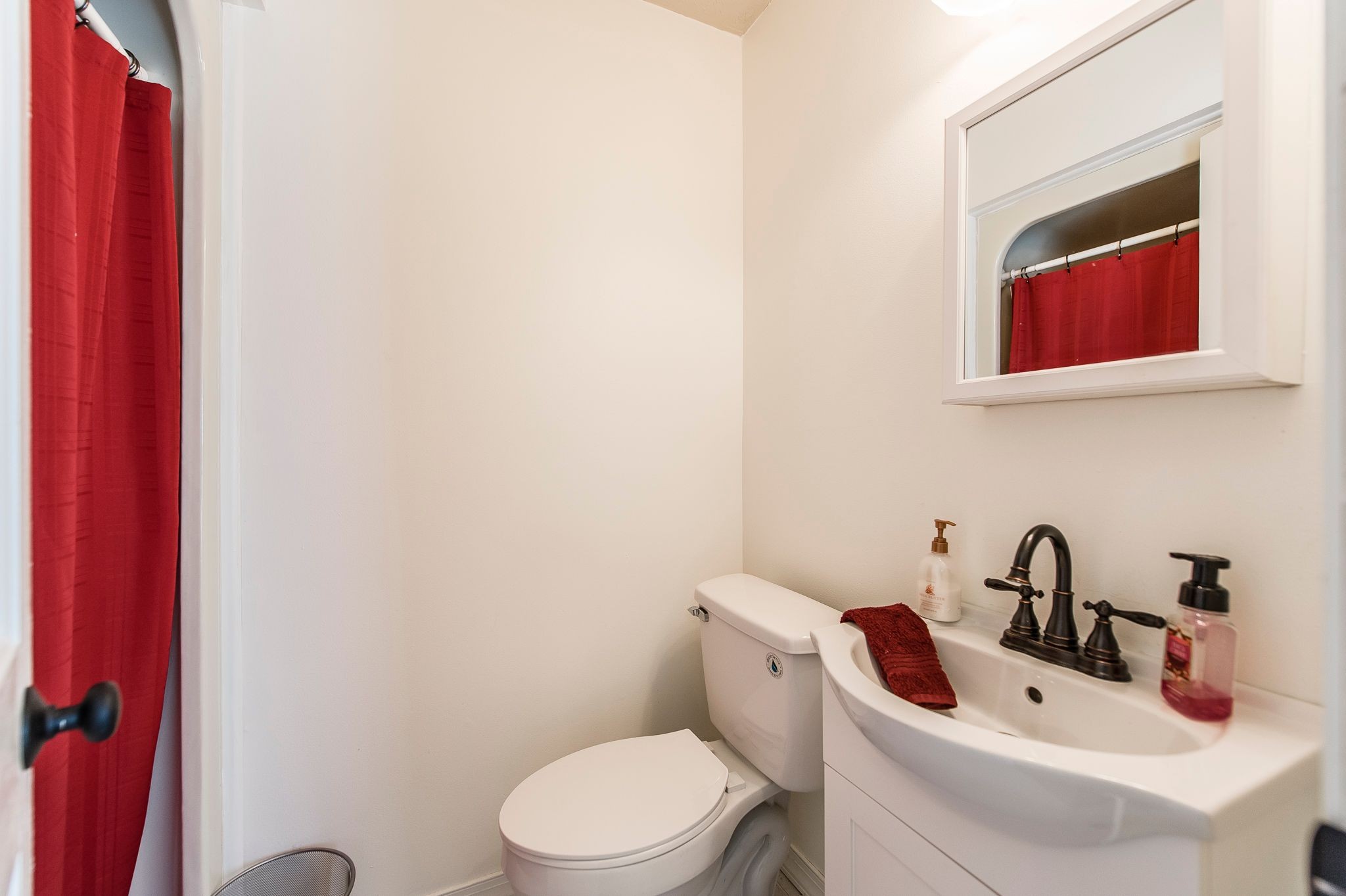 1881 Pinnacle Road Pleasant View, TN 37146 - Photo 24 of 62 a bathroom with a toilet a sink and mirror