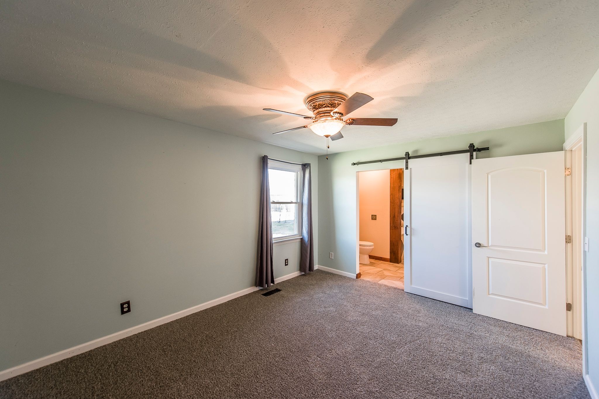 1881 Pinnacle Road Pleasant View, TN 37146 - Photo 27 of 62 an empty room with chandelier fan and closet