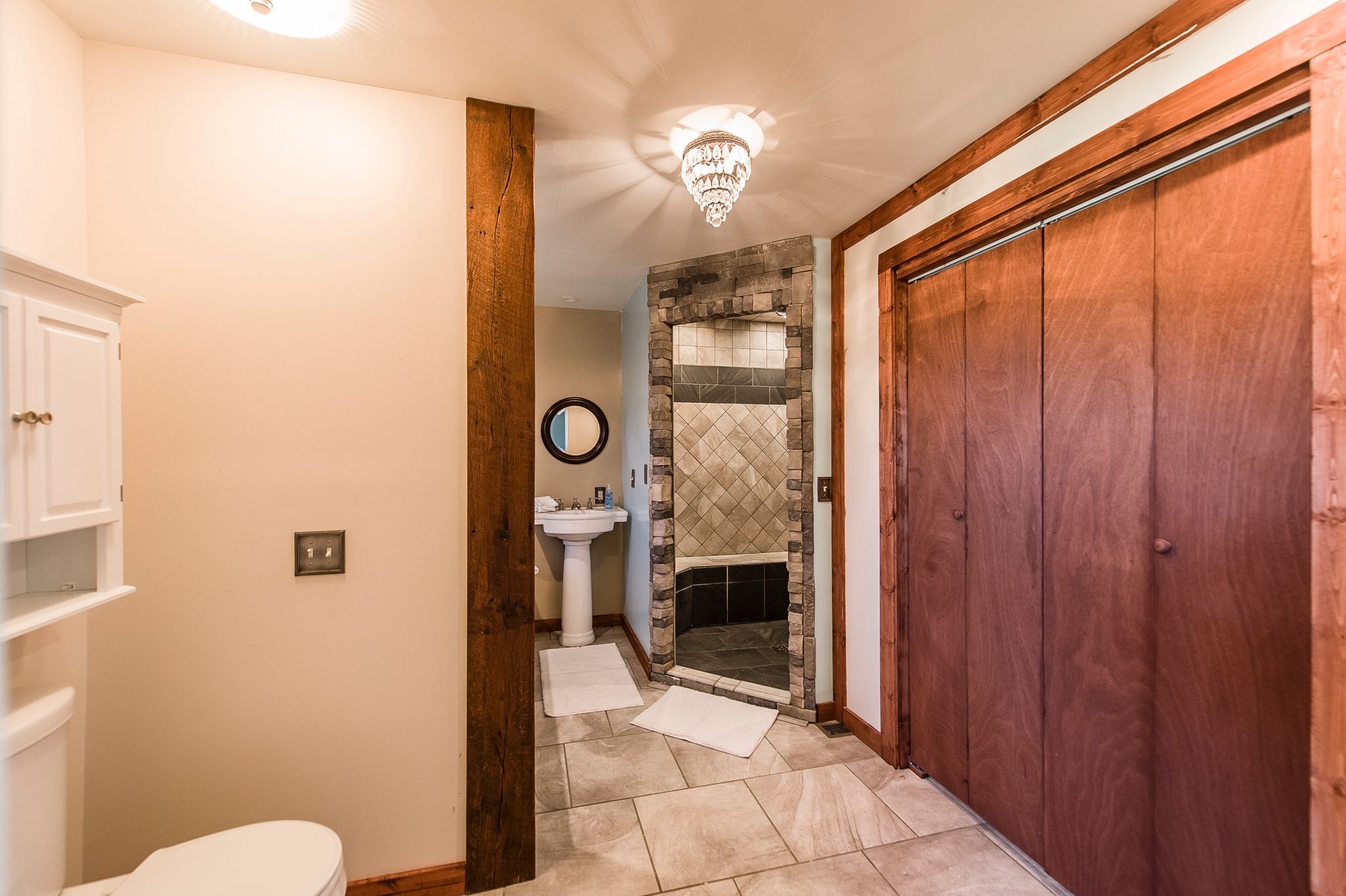 1881 Pinnacle Road Pleasant View, TN 37146 - Photo 29 of 62 a bathroom with a granite countertop shower a mirror and a toilet