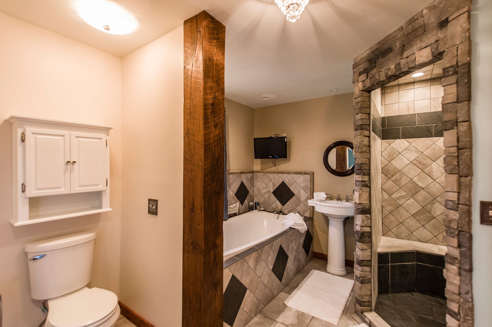 1881 Pinnacle Road Pleasant View, TN 37146 - Photo 30 of 62 a bathroom with a sink a toilet and a mirror