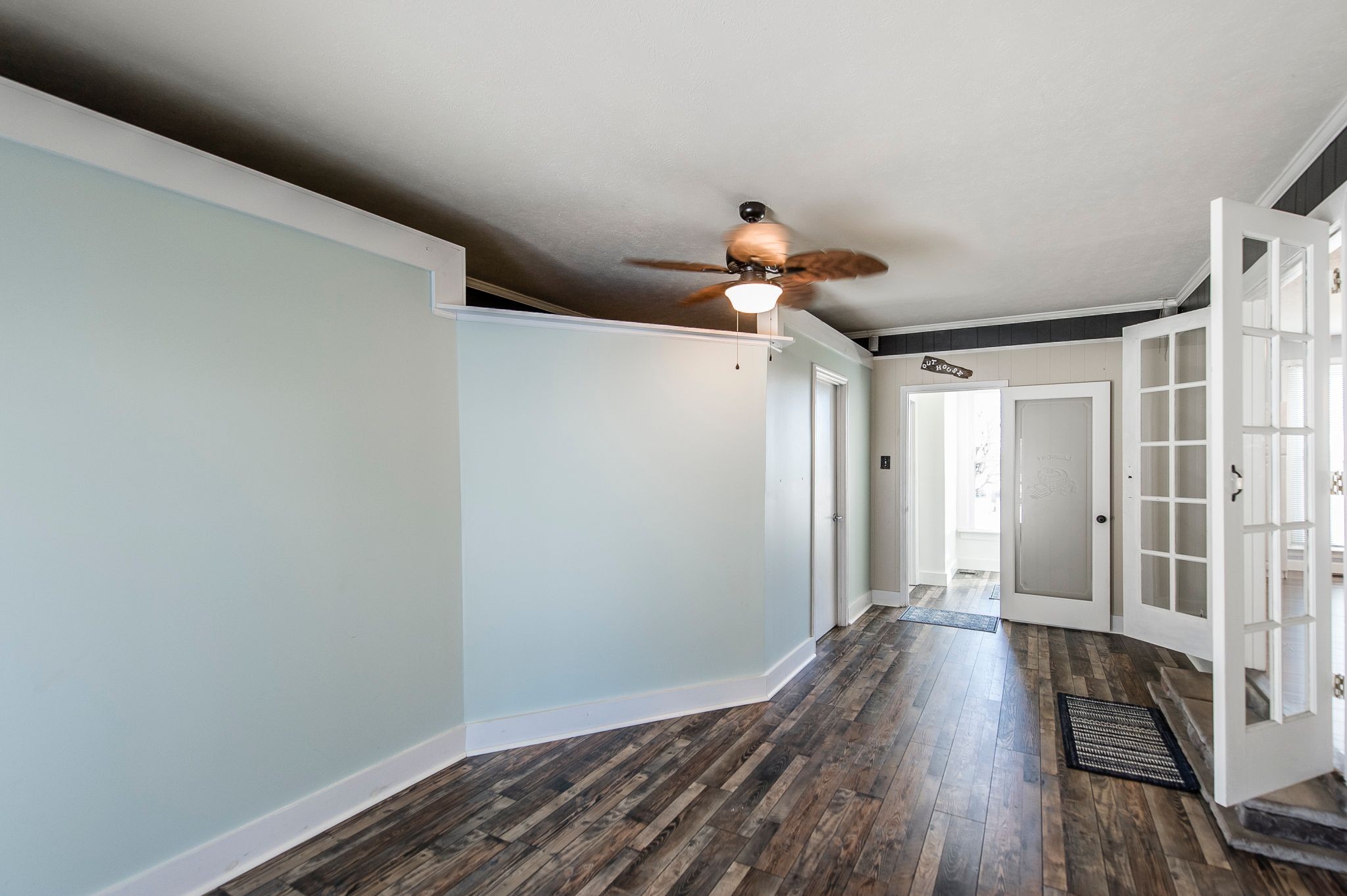 1881 Pinnacle Road Pleasant View, TN 37146 - Photo 33 of 62 a view of a hallway with wooden floor and a chandelier