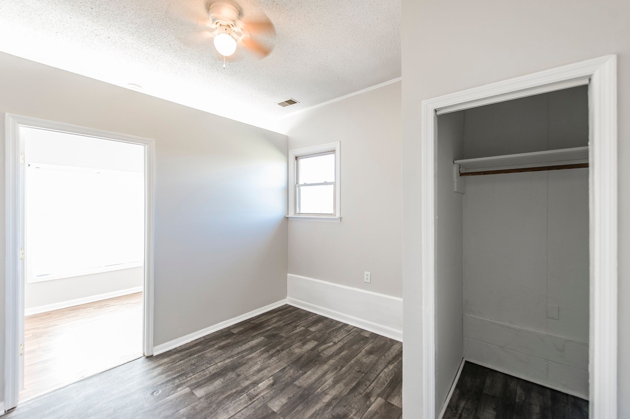 1881 Pinnacle Road Pleasant View, TN 37146 - Photo 43 of 62 a view of an empty room with wooden floor and a window