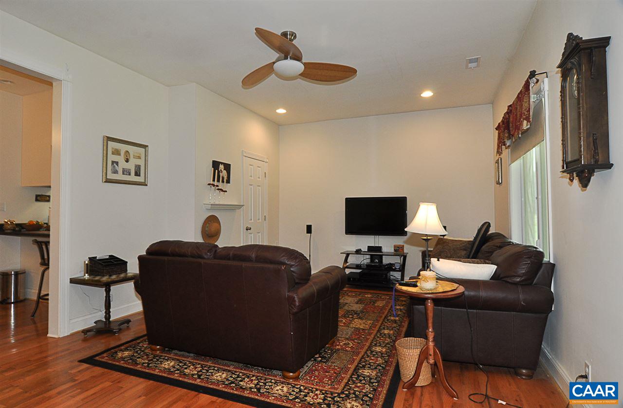 341 Grace Johnson Road Kents Store, VA 23084 - Photo 12 of 32 a living room with furniture and a flat screen tv