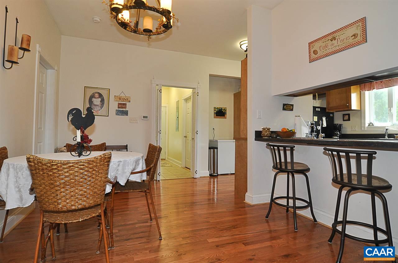 341 Grace Johnson Road Kents Store, VA 23084 - Photo 16 of 32 a dining room with furniture and wooden floor