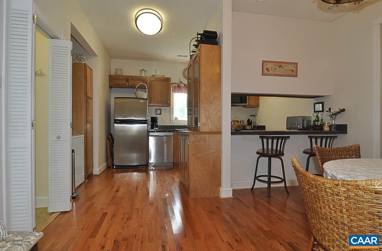 341 Grace Johnson Road Kents Store, VA 23084 - Photo 24 of 32 a kitchen with granite countertop a refrigerator and a stove top oven