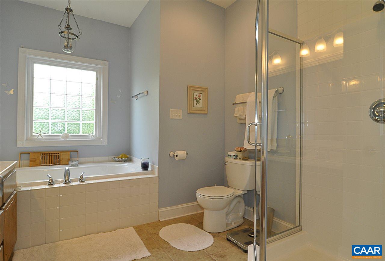 341 Grace Johnson Road Kents Store, VA 23084 - Photo 25 of 32 a bathroom with a sink toilet and shower