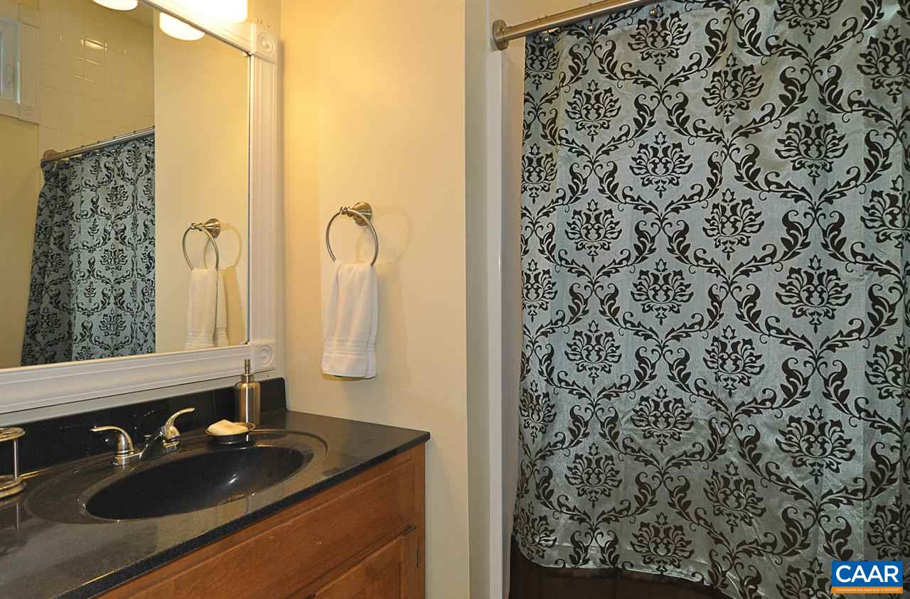 341 Grace Johnson Road Kents Store, VA 23084 - Photo 29 of 32 a bathroom with a sink and a mirror