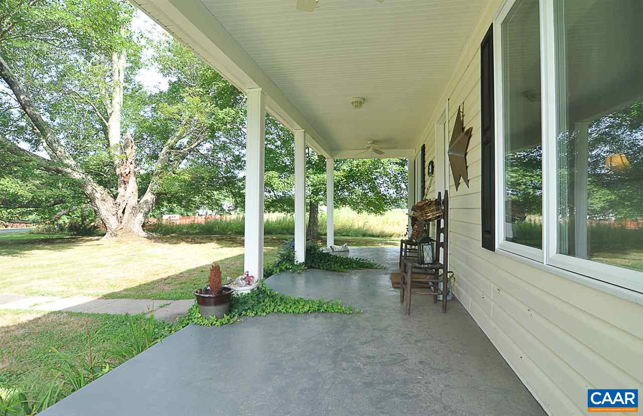 341 Grace Johnson Road Kents Store, VA 23084 - Photo 9 of 32 a view of a porch with chairs and backyard