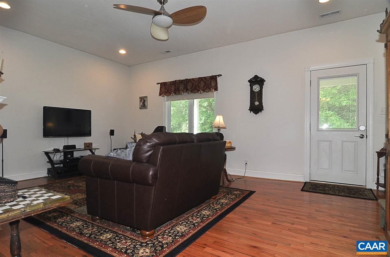 341 Grace Johnson Road Kents Store, VA 23084 - Photo 10 of 32 a living room with furniture and a flat screen tv