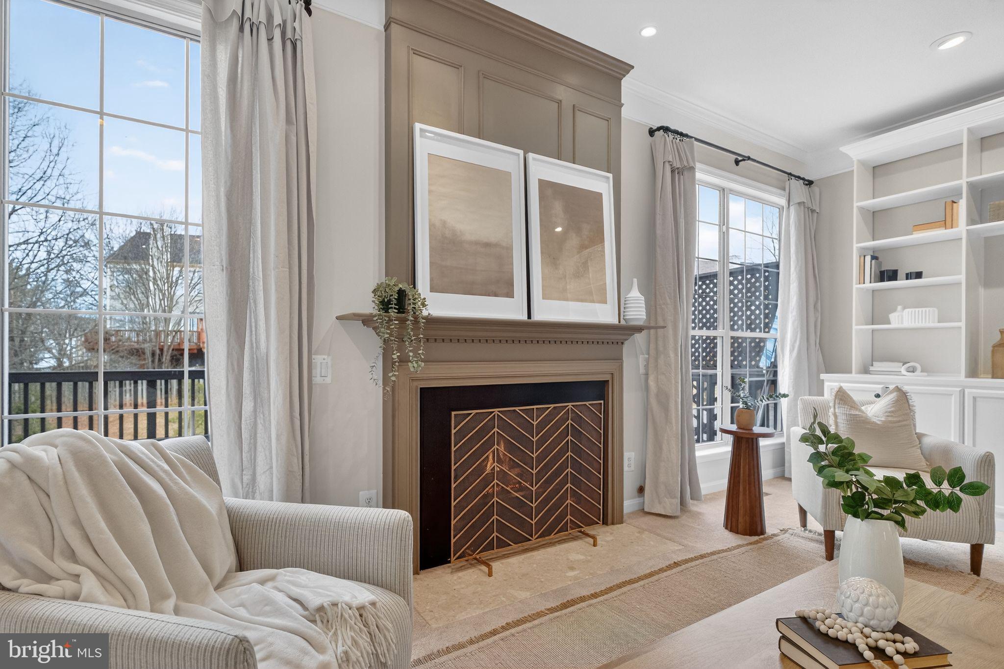 47610 Watkins Island Square Sterling, VA 20165 - Photo 15 of 48 a living room with furniture and a fireplace