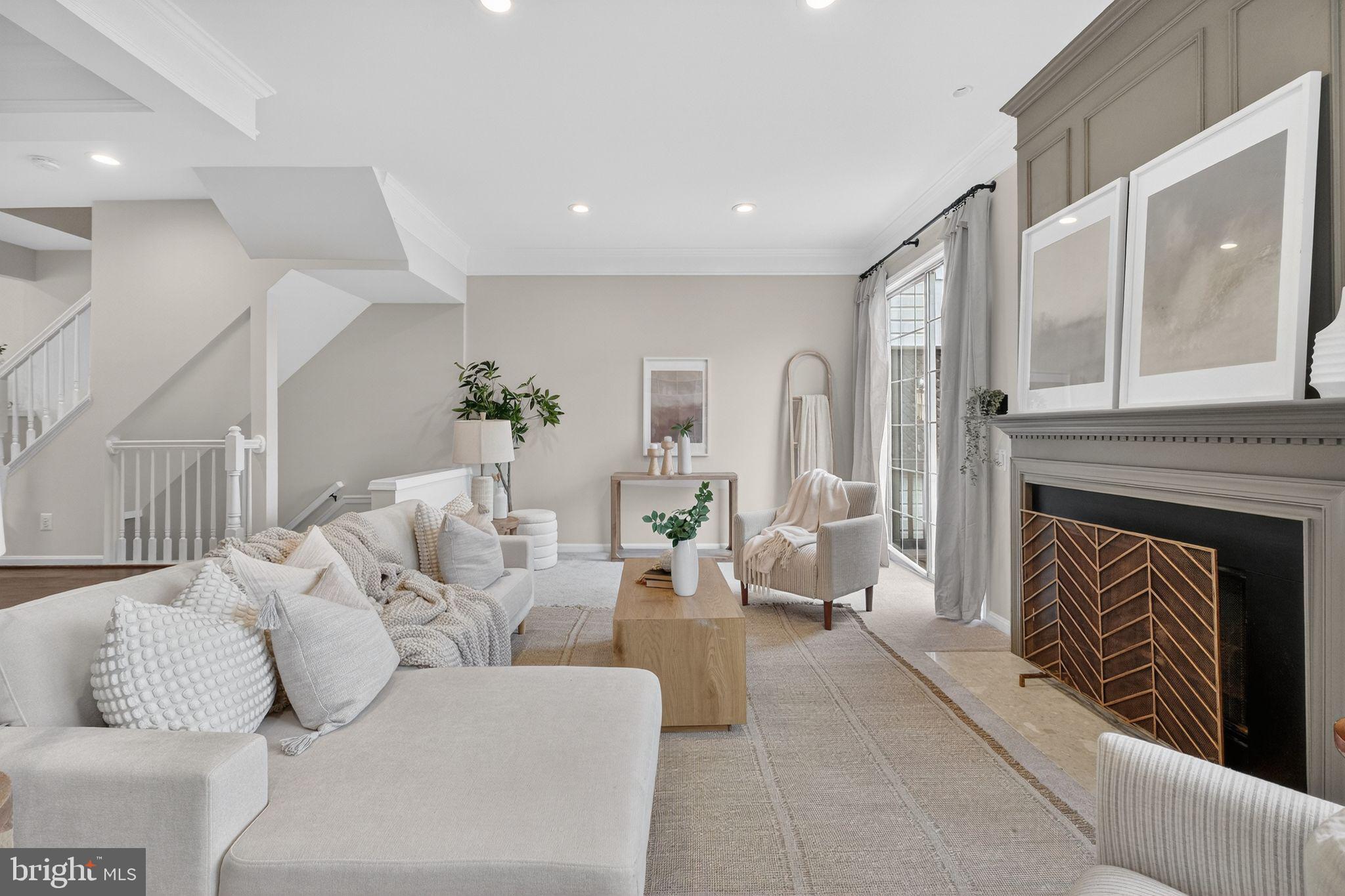 47610 Watkins Island Square Sterling, VA 20165 - Photo 16 of 48 a living room with furniture and a fireplace