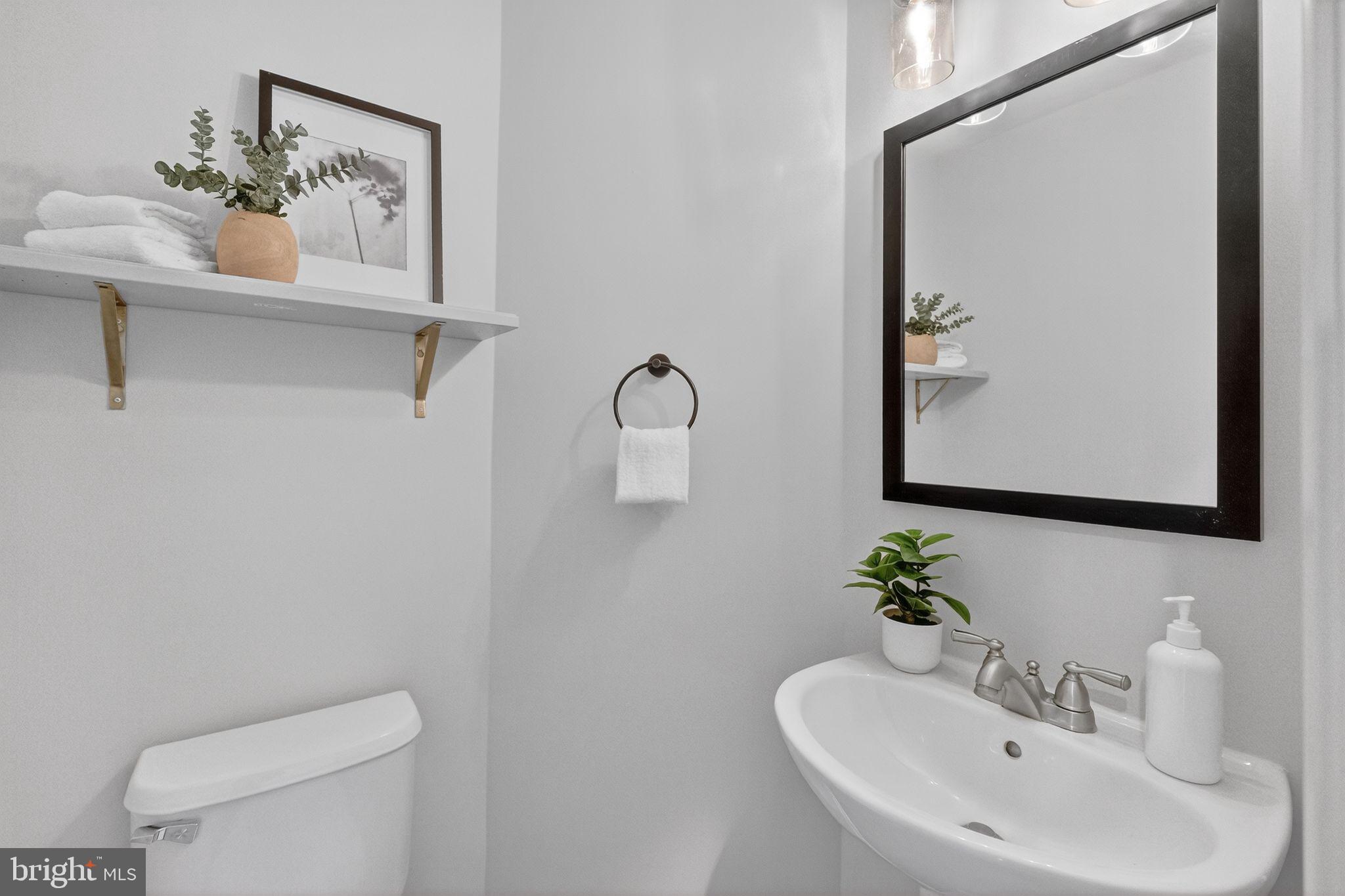 47610 Watkins Island Square Sterling, VA 20165 - Photo 19 of 48 a bathroom with a toilet sink and mirror