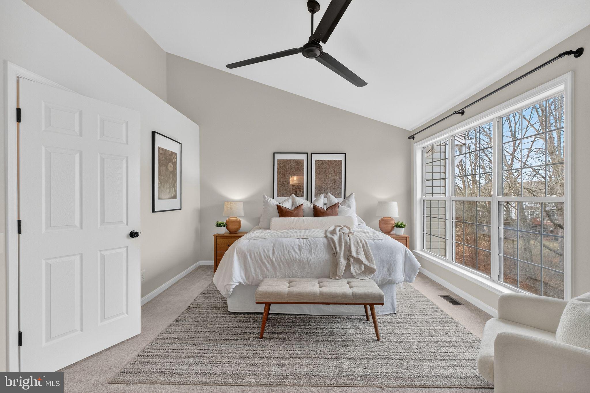 47610 Watkins Island Square Sterling, VA 20165 - Photo 20 of 48 a bedroom with a bed and a large window