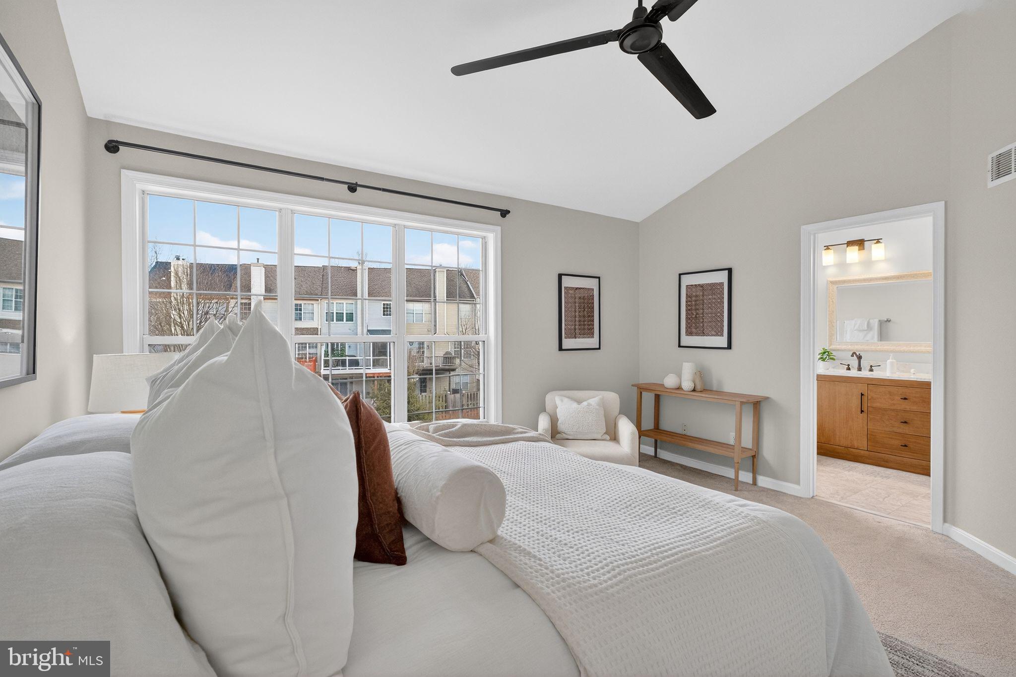 47610 Watkins Island Square Sterling, VA 20165 - Photo 22 of 48 a bedroom with a large bed and a balcony