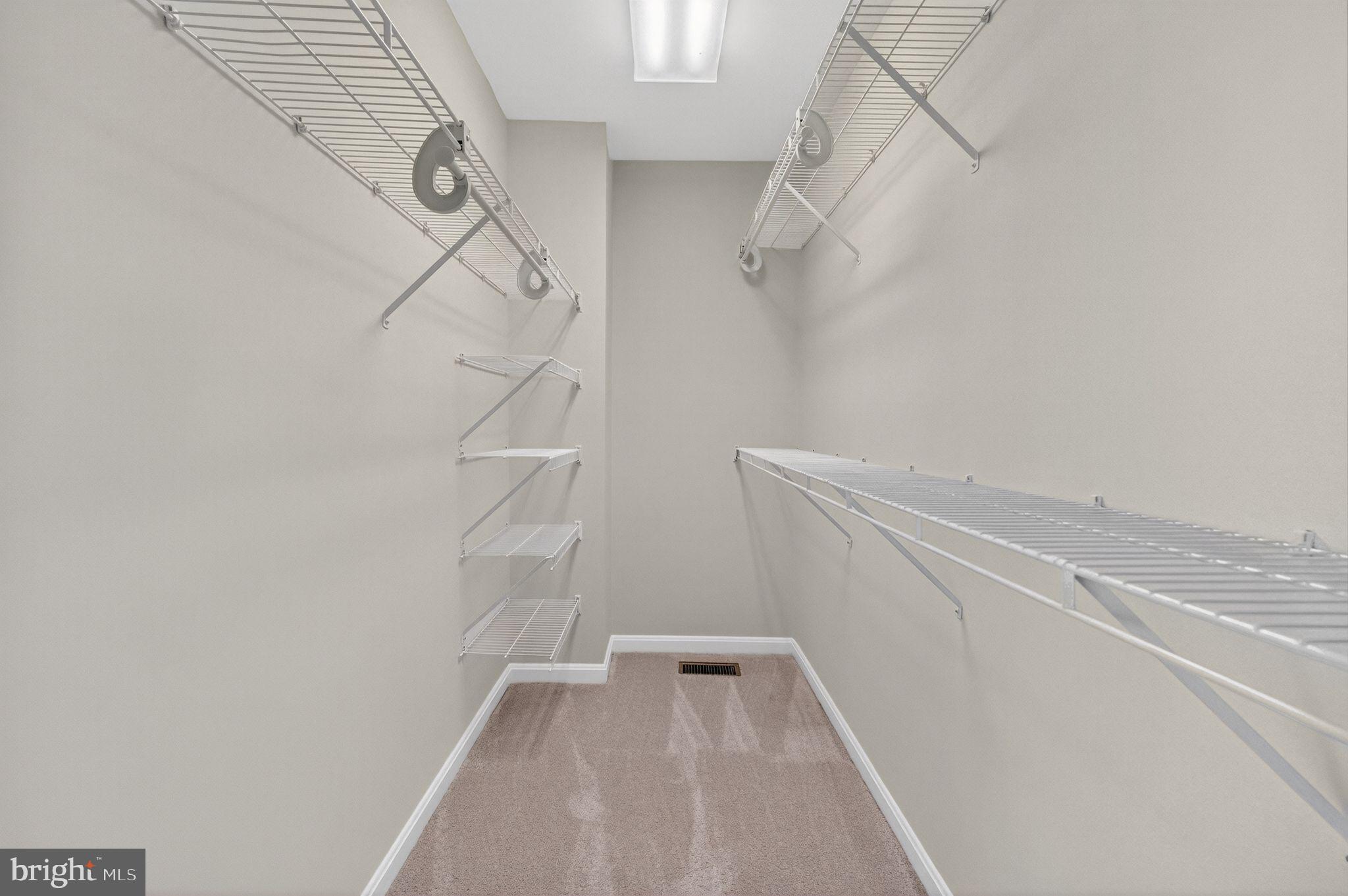 47610 Watkins Island Square Sterling, VA 20165 - Photo 26 of 48 a view of walk in closet with empty racks
