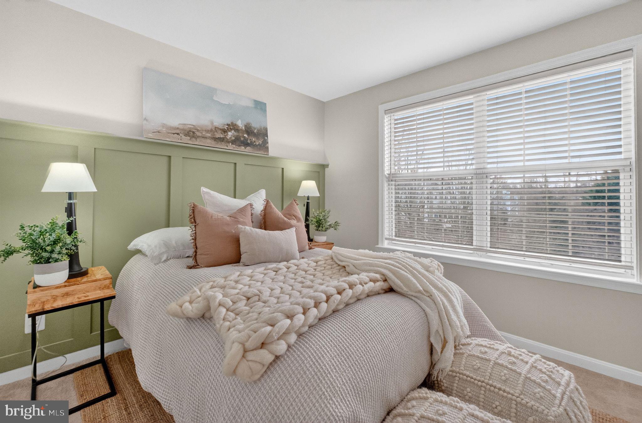 47610 Watkins Island Square Sterling, VA 20165 - Photo 27 of 48 a large bed sitting in a bedroom next to a window