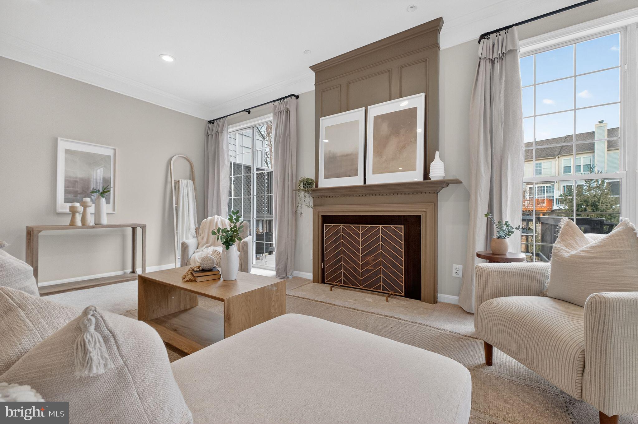 47610 Watkins Island Square Sterling, VA 20165 - Photo 3 of 48 a living room with furniture and a fireplace