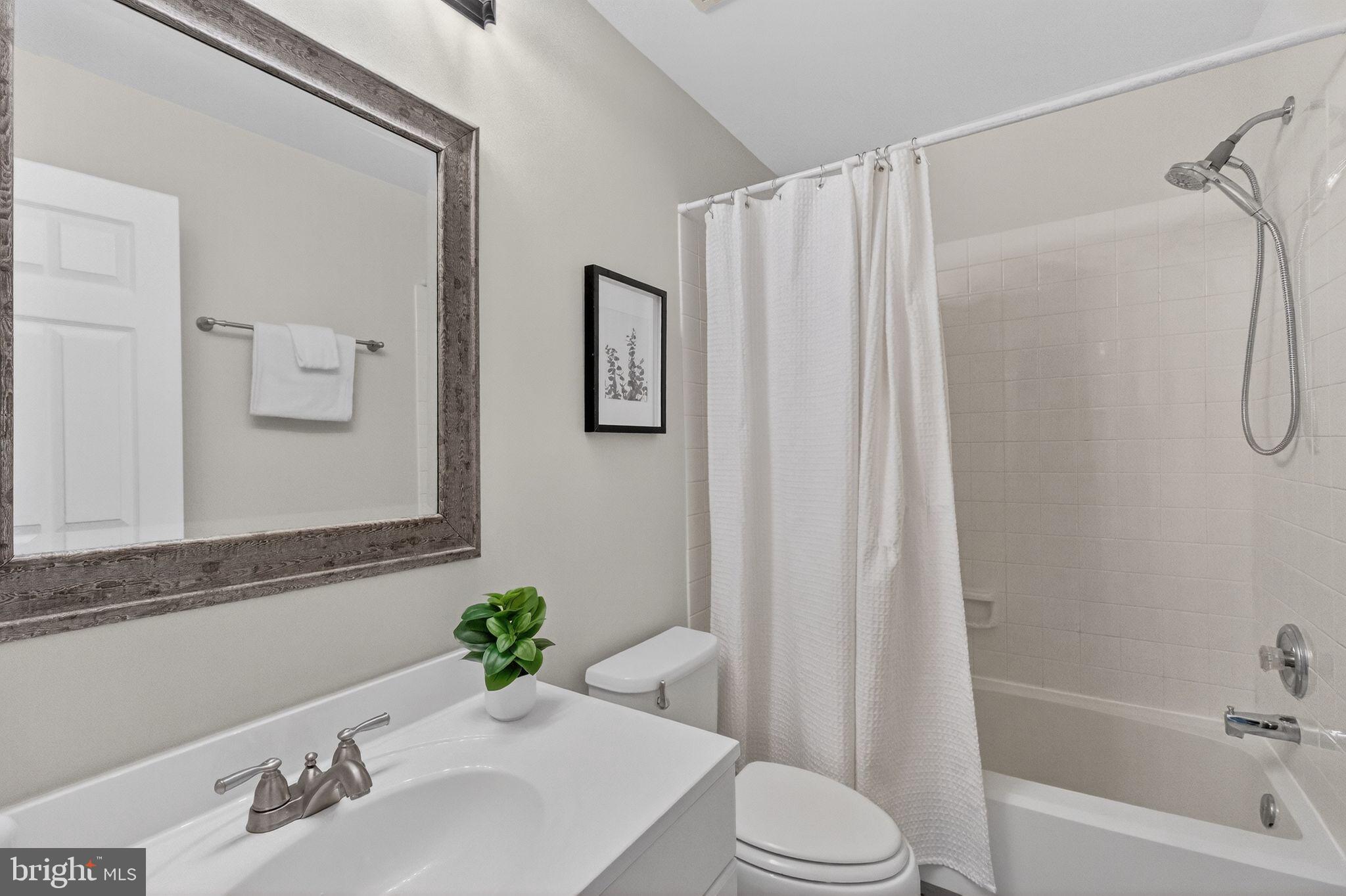 47610 Watkins Island Square Sterling, VA 20165 - Photo 31 of 48 a bathroom with a sink toilet and shower