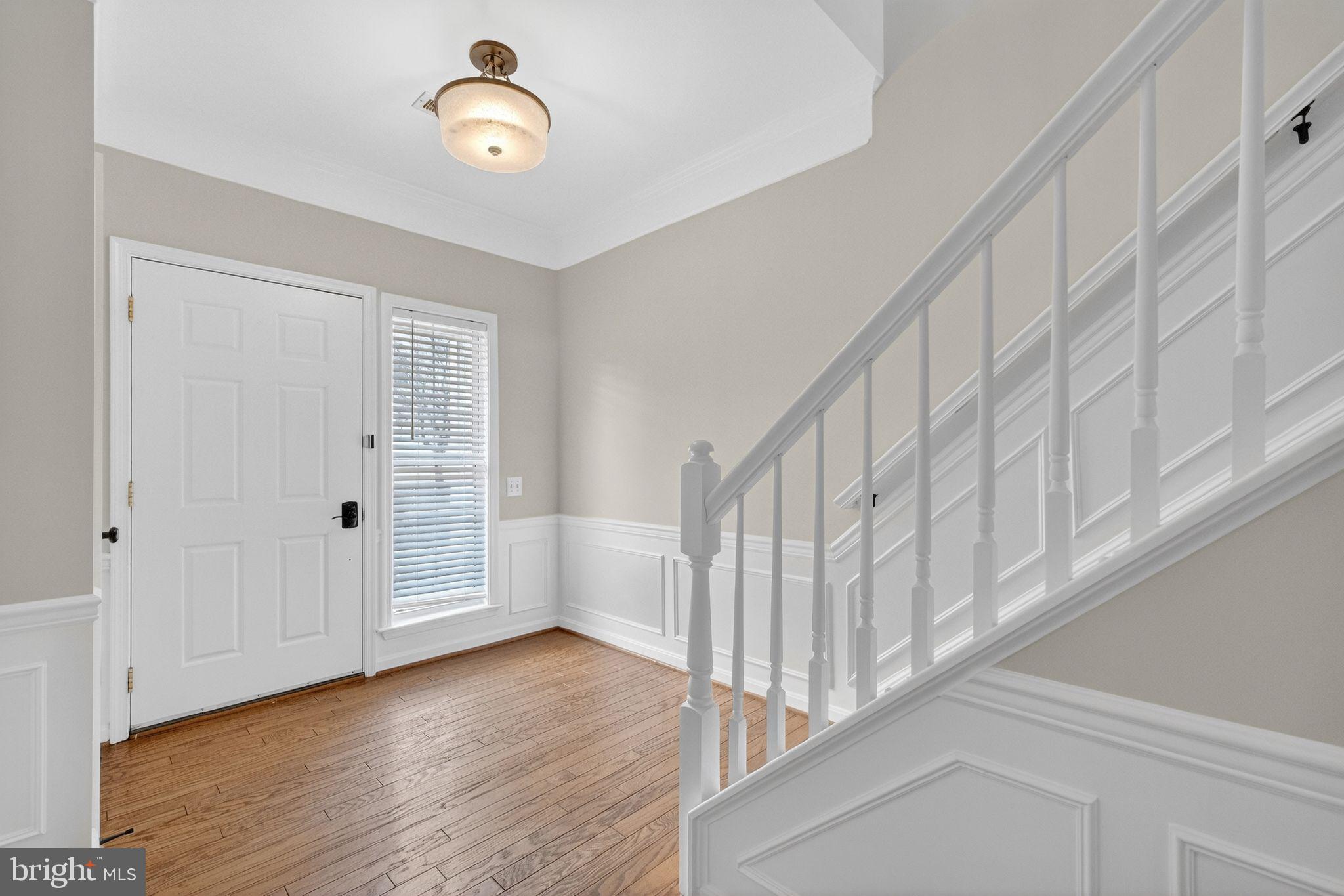 47610 Watkins Island Square Sterling, VA 20165 - Photo 32 of 48 a view of an entryway with wooden floor