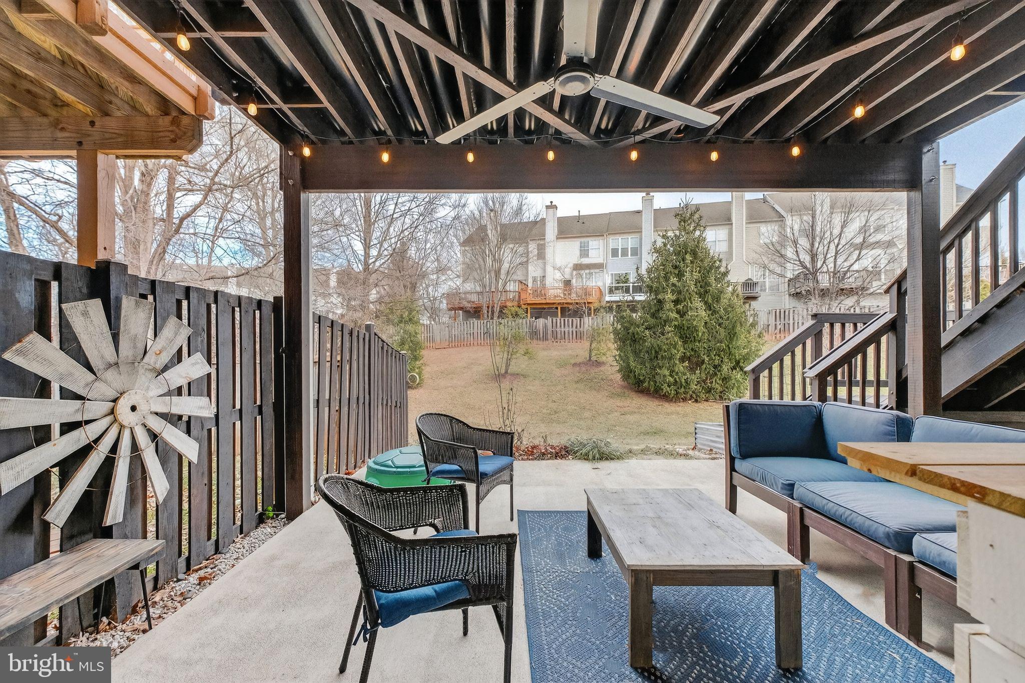 47610 Watkins Island Square Sterling, VA 20165 - Photo 36 of 48 a backyard of a house with table and chairs