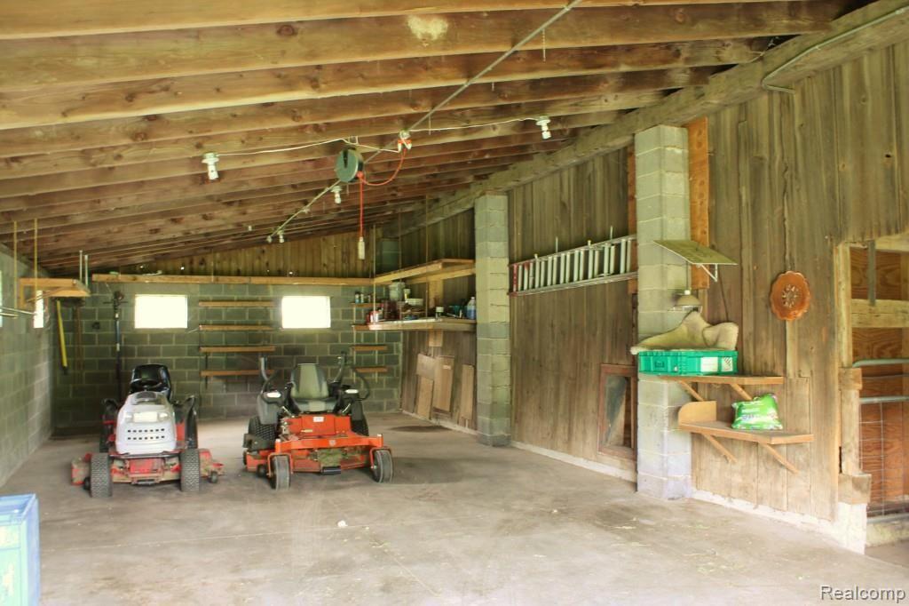 6544 General Squier Road Almont, MI 48003 - Photo 43 of 53 Inside of barn. Paved area for all your storage needs.