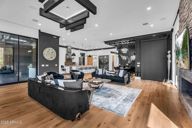 a living room with lots of furniture and kitchen view