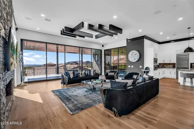 a kitchen with stainless steel appliances granite countertop a sink and a refrigerator