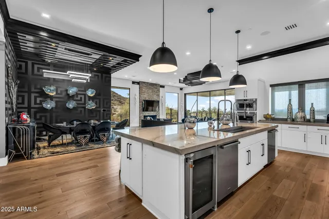 a view of a dining room with furniture and a chandelier