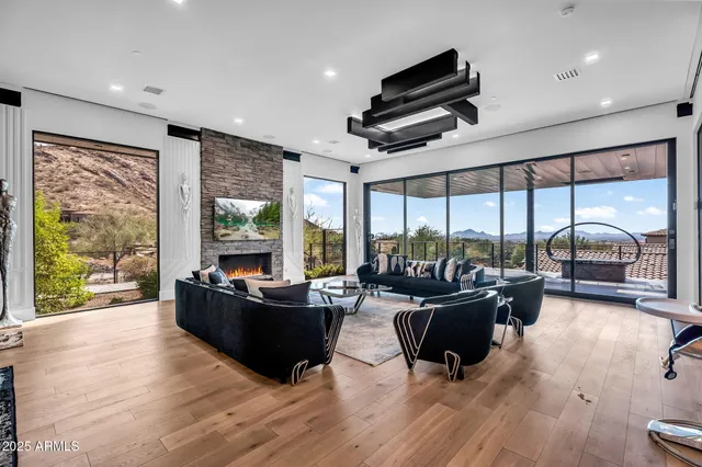 a living room with furniture and a large window