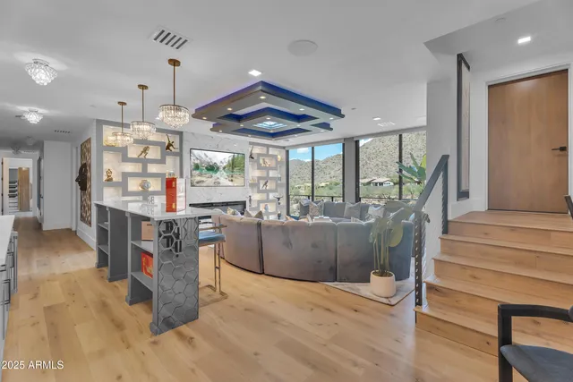 a large bedroom with a bed and glass window