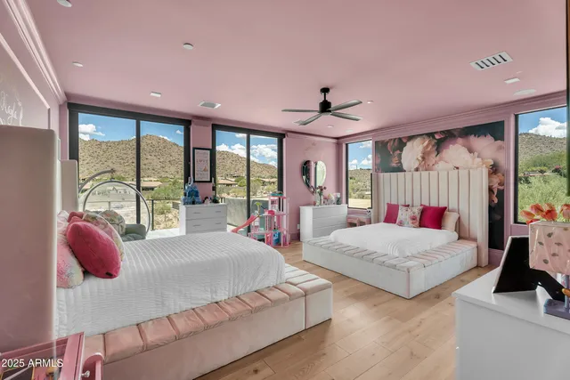 a bathroom with a double vanity sink mirror and a bathtub