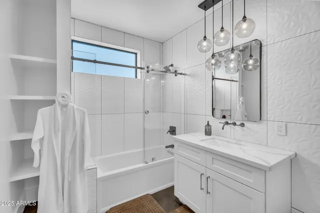 a kitchen with granite countertop a stove and cabinets