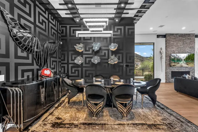 a table and chairs in front of a building