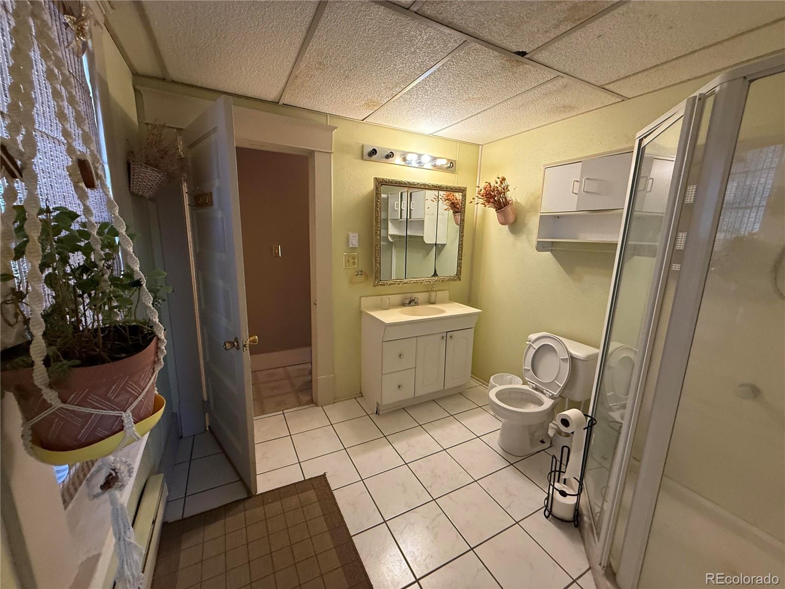 28894 Highway 24 Stratton, CO 80836 - Photo 18 of 41 a bathroom with a sink toilet and shower