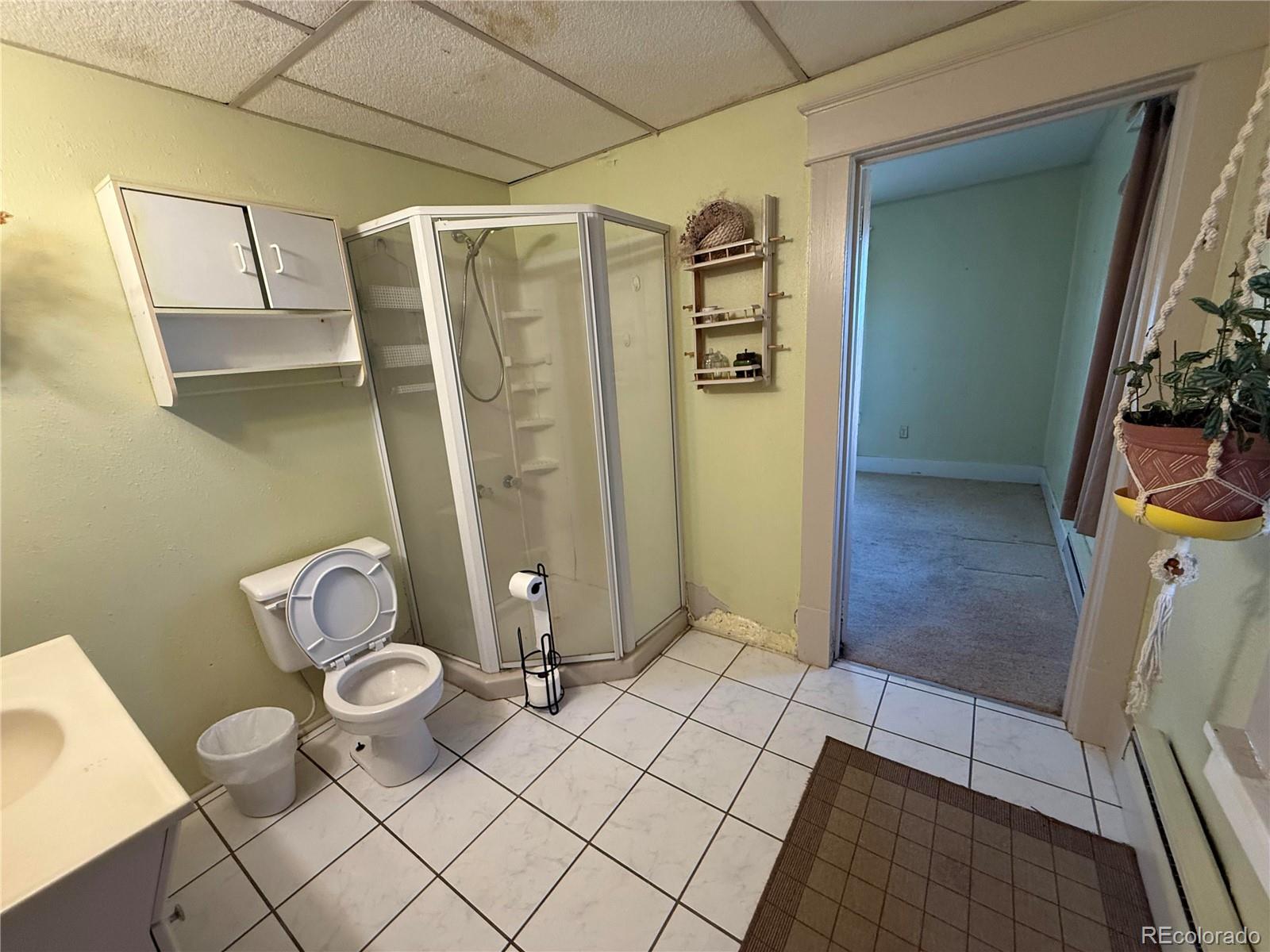 28894 Highway 24 Stratton, CO 80836 - Photo 19 of 41 a bathroom with a sink toilet and shower