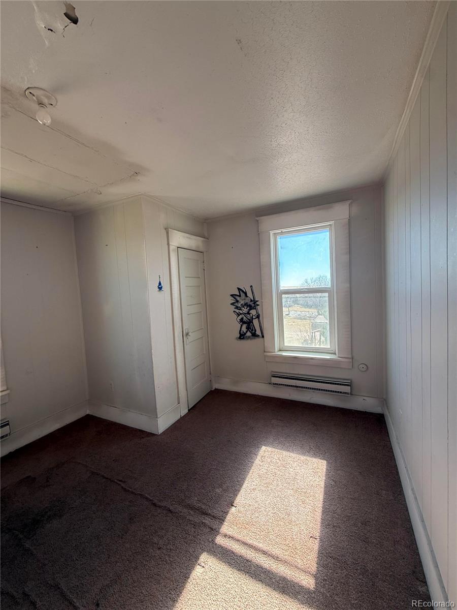 28894 Highway 24 Stratton, CO 80836 - Photo 25 of 41 an empty room with windows
