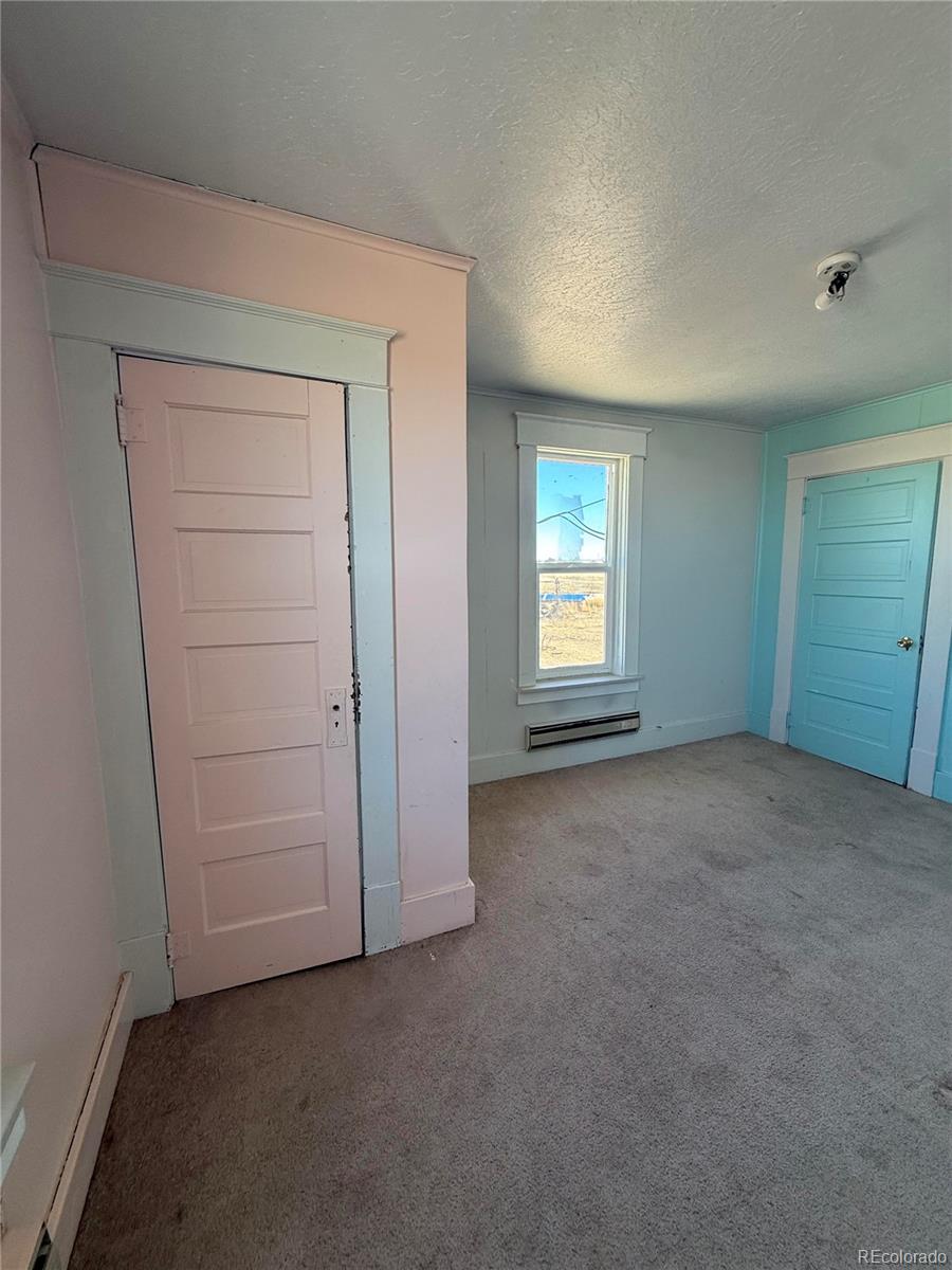28894 Highway 24 Stratton, CO 80836 - Photo 26 of 41 an empty room with windows and closet