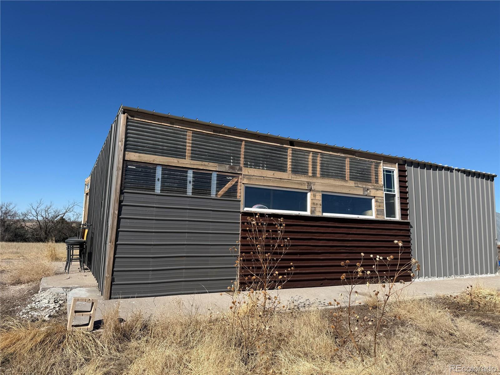28894 Highway 24 Stratton, CO 80836 - Photo 38 of 41 a front view of a house with a yard