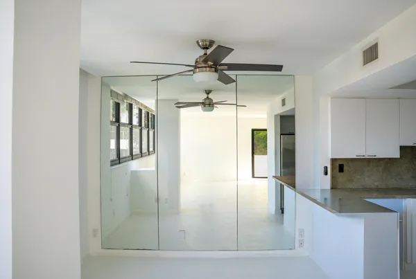 a bathroom with a shower and a window