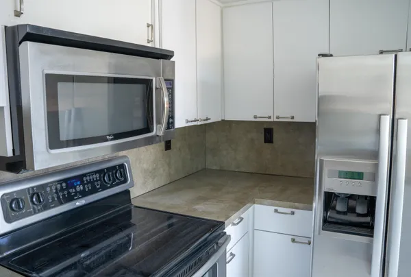 a kitchen with a stove and a microwave