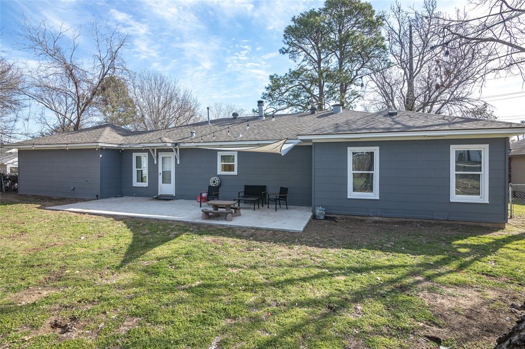 1308 Myrtle Street Denton, TX 76201 - Photo 21 of 35 a view of a house with swimming pool and a yard
