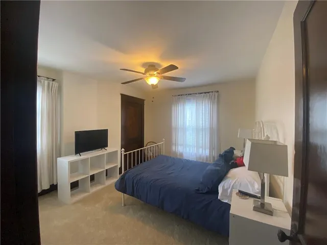 a bathroom with a shower and a mirror