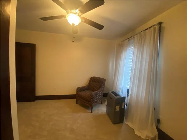 a bathroom with a sink a toilet and shower curtain