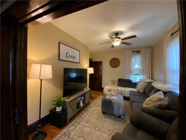 a view of a livingroom with wooden floor