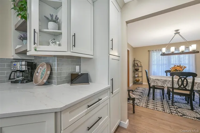 a large kitchen with a table and chairs
