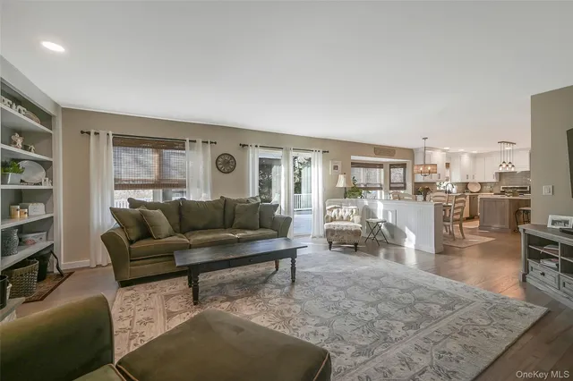 a living room with furniture and a table