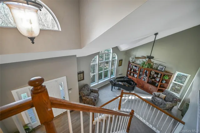 a view of a room with furniture and wooden floor