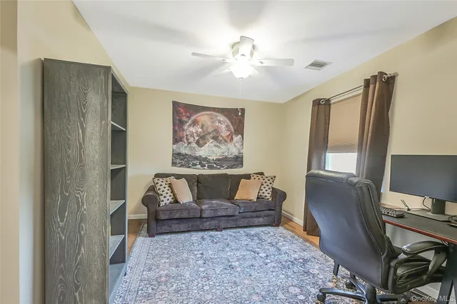 a living room with furniture and a rug