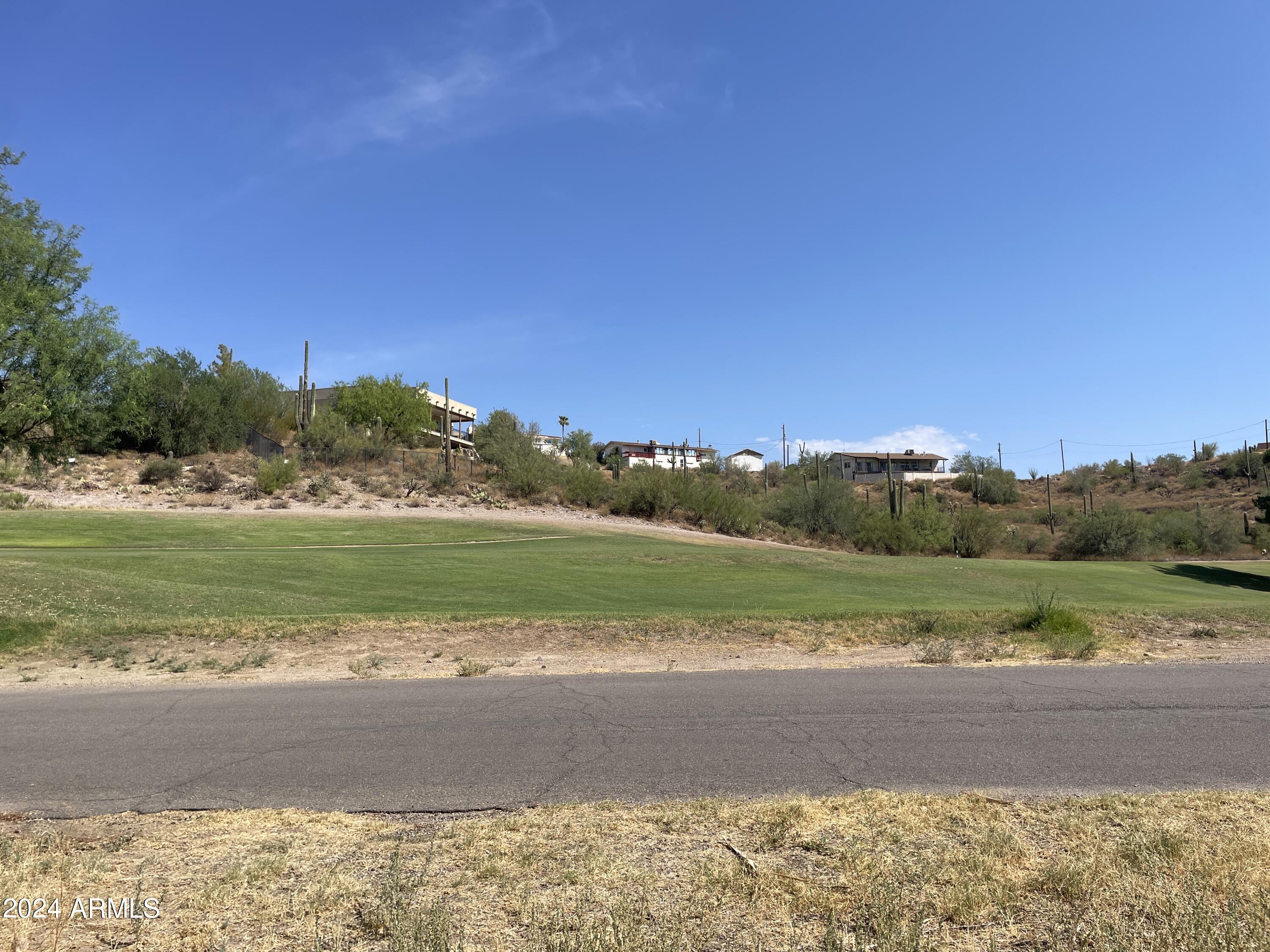 1393 East Silver King Road, Unit 1 Queen Valley, AZ 85118 - Photo 1 of 9 a view of an ocean and beach