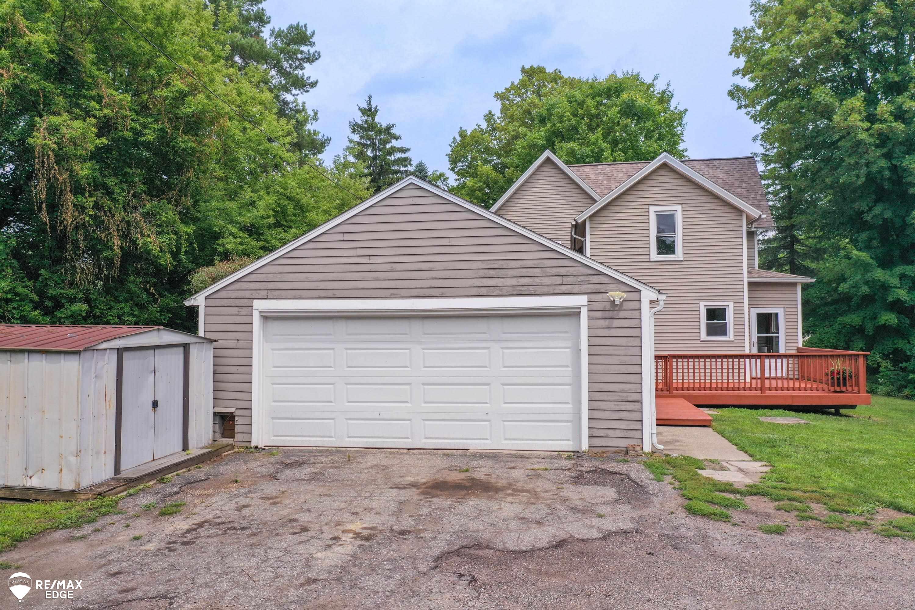 6231 Calkins Road Flint, MI 48532 - Photo 40 of 52 Extra Shed to left